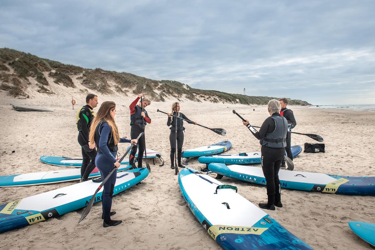 Surfere ved Husmoderstranden