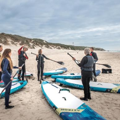 Surfere ved Husmoderstranden